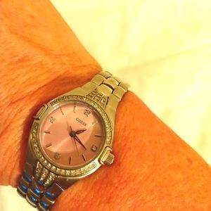 Guess pink rhinestone watch silver tone band. For a small adult wrist.